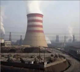  ?? ASSOCIATED PRESS ?? Smoke and steam spew from the sprawling complex that is a part of the Jiujiang steel and rolling mills in Qianan in northern China’s Hebei province in 2016. The Commerce Department is urging President Donald Trump to impose tariffs or quotas on...