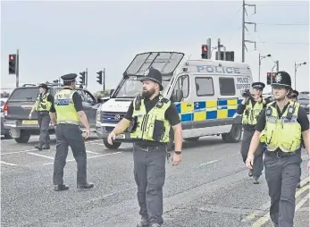  ?? ?? There was a large police presence at the Cambridge game