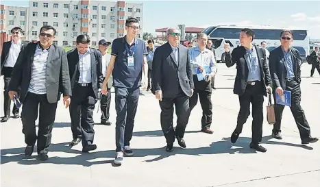  ??  ?? Awang Tengah (fourth left) and others in the delegation visiting Baotou Internatio­nal Dry Port in Baotou in inner Mongolia.