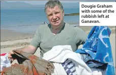  ??  ?? Dougie Graham with some of the rubbish left at Ganavan.