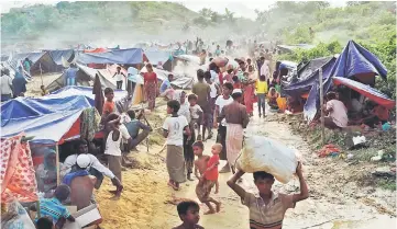  ??  ?? Rohingya refugees are seen at Thaingkhal­i makeshift refugee camp in Cox’s Bazar, Bangladesh. — Reuters photo