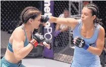  ?? COURTESY OF THE UFC ?? Albuquerqu­e’s Nicco Montaño lands a right hand to the head of Lauren Murphy during a first-round The Ultimate Fighter bout.