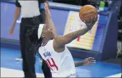  ?? SUE OGROCKI — THE ASSOCIATED PRESS ?? Clippers guard Terance Mann takes a shot in the second half against the Thunder on Sunday in Oklahoma City.