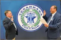  ?? Photo by Suzy Irwin ?? ■ Texarkana College Texarkana College President Dr. Jason Smith, right, swears in new Trustee Brad Carlow.