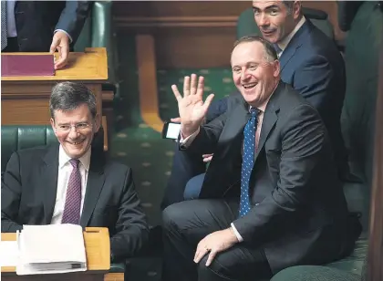  ?? Picture / Mark Mitchell ?? John Key in jovial form yesterday with ministers (left) Chris Finlayson and (rear) Nathan Guy.