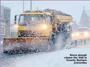  ??  ?? Snow plough clears the A68 in County Durham yesterday