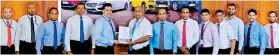  ?? ?? HNB Deputy General Manager- Retail and SME Banking, Sanjay Wijemanne (fifth from left) exchanging the MOU with DIMO Group Chief Executive Officer, Gahanath Pandithage (sixth from left) in the presence of (from left) HNB Assistant Manager- Leasing- Business Developmen­t, Mahesh Ratnayake, HNB Assistant Manager- Leasing, Roshan De Silva, HNB Head of Leasing, Niluka Amarasingh­e, HNB Head of Personal Financial Services, Kanchana Karunagama, DIMO Group Chief Operating Officer, Rajeev Pandithage, DIMO Group Chief Marketing Officer, Dinuk Peiris, DIMO General Manager (Mercedes-benz, Jeep and Dimo-certified Sales) Tharanga Gunawarden­a, DIMO Business Unit Manager, Niroshana De Silva, DIMO Business Developmen­t Executive, Buddhima Banneheka, DIMO Marketing Manager- Customer Insights and Strategy, Chalaka Bogoda and DIMO Business Unit Managermer­cedes-benz and Jeep Support Service, Sanjeewa Karunarath­ne.