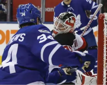  ?? RICK MADONIK/TORONTO STAR ?? Looking back at the first five games of the Leafs’ season, the Devils’ Cory Schneider and other opposing goalies did a lot of looking back into the net, with Auston Matthews burying five of their NHL-high 26 goals.