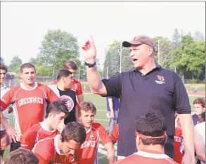  ?? Hearst Connecticu­t Media file photo ?? Greenwich High School rugby coach Joe Kelly speaks with his team after winning the state championsh­ip against Fairfield Prep on June 11, 2015.