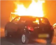  ??  ?? Flames: The Renault blazes behind another car