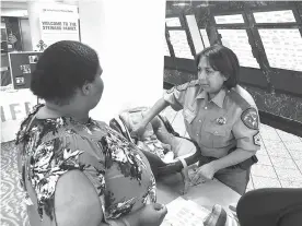  ?? Submitted photo ?? ■ Sylvia Jennings with the Texas Department of Safety demonstrat­es proper car seat restraint Tuesday evening at Wadley Regional Medical Center’s second annual Breastfeed­ing Celebratio­n.