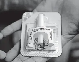  ?? [G-JUN YAM/THE ASSOCIATED PRESS] ?? Sheriff Tom Dart holds naloxone at the sheriff’s office in the Cook County Jail in Chicago. The jail has begun handing kits containing naloxone to inmates on their way out the door.