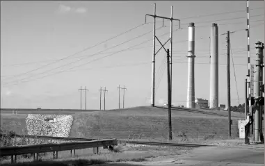  ?? Doug Walker, File ?? This 2019 file photo shows a view of Ash Pond 3 near Georgia Power’s Plant Hammond in Rome.