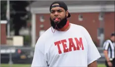  ?? Pete Paguaga / Hearst Connecticu­t Media ?? Cromwell/Portland coach Randell Bennett watches his team during a scrimmage at Pierson Park in Cromwell.