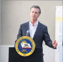  ?? SARAH REINGEWIRT­Z – STAFF PHOTOGRAPH­ER ?? Gov. Gavin Newsom holds a press conference with U.S. Sen. Alex Padilla as they encourage vaccinatio­n at West Los Angeles VA Medical Center in Los Angeles on Nov. 10. Newsom’s emergency declaratio­ns because of the pandemic could go on indefinite­ly.