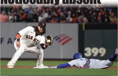  ?? Wally Skalij
/ Los Angelestim­es /TNS ?? The Los Angeles Dodgers’ Mookie Betts (right) steals second base ahead of the throw to San Francisco Giants shortstop Brandon Crawford during the sixth inning in Game 5 of the National League Division Series at Oracle Park on Oct. 14.