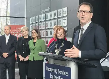  ?? JENNIFER SALTMAN ?? Health Minister Adrian Dix announces at Surrey City Hall on Monday that the B.C. government will forge a concept plan for a new hospital in Surrey, something the NDP promised during the last election.