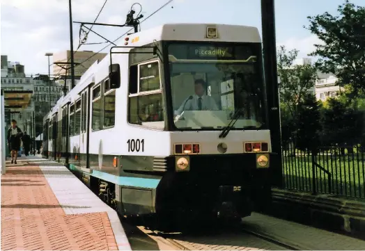  ??  ?? T68 1001 was the first second-generation tram to be delivered to the UK, arriving in Manchester on August 29 1991. On July 20 1992, 1001 stands at Piccadilly Gardens on the first day of Metrolink services to Piccadilly station.