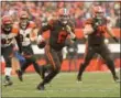  ?? TIM PHILLIS — FOR THE NEWS-HERALD ?? Baker Mayfield looks downfield during the Browns’ victory over the Bengals on Dec. 23 at FirstEnerg­y Stadium.