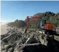  ??  ?? The sea wall is being extended at Punakaiki to save the beach camp from further erosion.