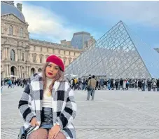  ?? | Supplied ?? TRAVEL content creator Aaliya Adam at the entrance to the Louvre Museum in Paris.