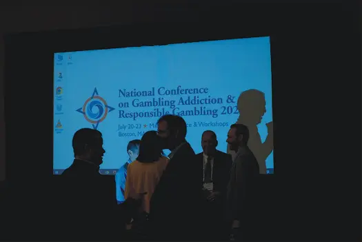  ?? AMIR HAMJA / THE NEW YORK TIMES FILE (2022) ?? Attendees talk during a break at the 2022 National Conference on Gambling Addiction & Responsibl­e Gambling in Boston. March is Problem Gambling Awareness Month.