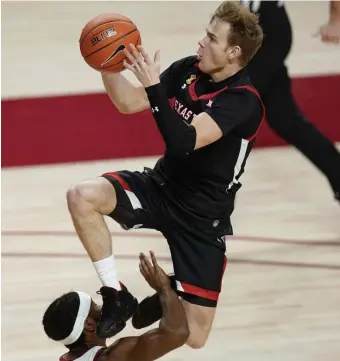  ?? AP ?? FACE FOUL: Texas Tech guard Mac McClung, top, is fouled by Iowa State guard Tre Jackson Saturday in Ames, Iowa.