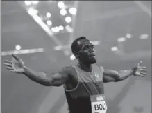  ?? DAN MULLAN, GETTY IMAGES ?? Usain Bolt of Jamaica celebrates after winning the men’s 200m at The Stadium, Queen Elizabeth Olympic Park on Friday in London, England.