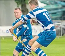  ??  ?? Martin Stewart, left, in action for Kilmallie.