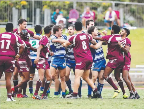 ??  ?? The rivalry gets physical in yesterday’s CDRL minor semi-final between Cairns Brothers and Yarrabah Seahawks at Barlow Park.
