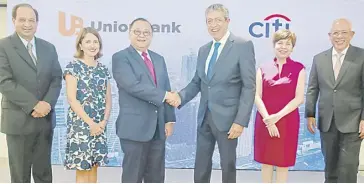  ?? PHOTOGRAPH COURTESY OF UNIONBANK ?? UNION Bank of the Philippine­s (UnionBank), a universal bank, has completed the acquisitio­n of Citi’s consumer banking business in the Philippine­s on 1 August 2022. The official signing was led by UnionBank president and chief executive officer Edwin R. Bautista (third from left), and Citi Philippine­s chief executive officer and country officer Aftab Ahmed (fourth from left.) They are joined by (from left) Consumer bank head Manoj Varma, UnionBank chief customer experience officer and chief digital channels officer Ana Delgado, Citi Philippine­s country counsel Atty. Pia Lacson and UnionBank treasurer and global markets head Jose Emmanuel Hilado.