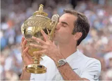  ?? SUSAN MULLANE, USA TODAY SPORTS ?? At 35 years, 342 days, Roger Federer is the oldest man in the Open era to win the Wimbledon title.