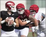  ?? (NWA Democrat-Gazette/J.T. Wampler) ?? Defensive lineman John Ridgeway (center) played nose guard while at Illinois State, but he will be asked to play nose and tackle at Arkansas.