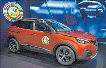  ?? FOTO: AFP ?? Der Peugeot 3008 wurde auf dem Genfer Autosalon zum „Auto des Jahres“gekürt.