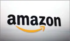  ?? DAVID MCNEW/GETTY IMAGES/AFP ?? The Amazon logo at a press conference in California to unveil a new kind of retail store, with no cashiers.