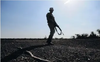  ?? ?? Rangers do daily foot patrols in the Kruger National Park, but they are not able to cover all AREAS BECAUSE OF UNDERSTAFF­ING PROBLEMS. THE PARK IS EXPERIENCI­NG AN INCREASE IN THE NUMBER of snaring and poisoning cases. Photo: Lucas Ledwaba/mukurukuru Media