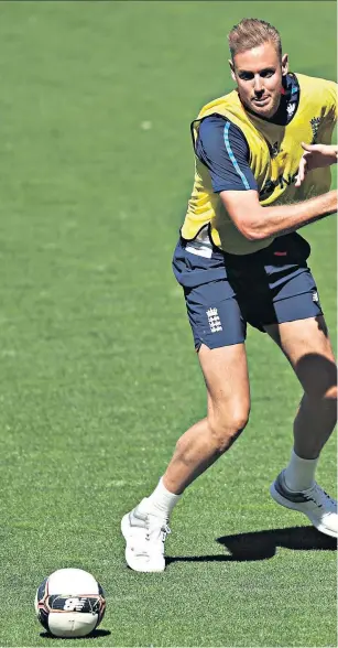  ??  ?? Fancy footwork: Stuart Broad and Chris Woakes play football in training