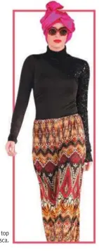  ??  ?? Batik-style print pants and a sleek top
with detailing from Veejay Floresca.