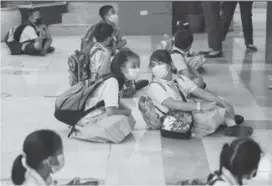  ?? News/File photo) (George Calvelo/ABSCBN ?? Students prepare to enter their respective classrooms at the Jose Magsaysay Elementary School in Makati City on March 30, 2022.