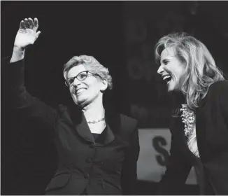  ?? NATHAN DENETTE/THE CANADIAN PRESS ?? Sandra Pupatello, right, celebrates Kathleen Wynne’s victory Saturday. Pupatello had been the favourite going into the day, but her camp was shaken when Wynne was just two votes behind on the first ballot.