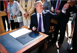  ?? Photo courtesy of mass.gov ?? Massachuse­tts Governor Charlie Baker signs off on bills for 2019.