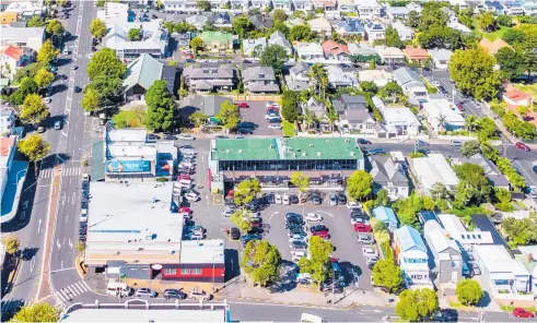  ??  ?? The Ponsonby Rd-Cowan St corner site encompasse­s three buildings and car park area. The property is surrounded by affluent suburbs and is only a short distance from Auckland’s CBD.