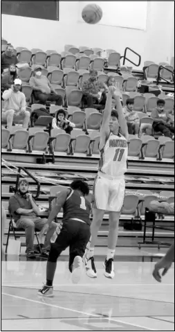  ?? Photo by Gerren Smith ?? PURE SHOOTER: Owen Tillery (11) drills one of five trifectas (3-pointers) from behind the arc against Mineral Springs Tuesday. Tillery led all scorers with a dynamic shooting display for 19 points in Magnet Cove’s 61-26 win against Mineral Springs.