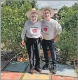  ?? Weiser f amily ?? FROM TEACHING TO FARMING Weiser, left, with his son Alex. The pair focused on new and experiment­al varieties of produce.