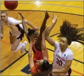  ?? STEPHEN SPILLMAN — THE ASSOCIATED PRESS ?? Stanford guard Haley Jones (30) shoots over Oklahoma State forward Natasha Mack (4) and guard Neferatali Notoa during the second round of the NCAA Tournament in San Antonio on Tuesday.