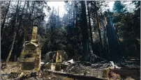  ?? SHMUEL THALER — THE SANTA CRUZ SENTINEL ?? The fireplace of the Nature Lodge Museum and Store at Big Basin Redwoods State Park stands among the devastatio­n Aug. 28 wrought by the CZU August Lightning Complex, which destroyed nearly all buildings and burned thousands of trees at the park.