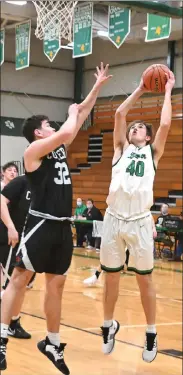  ?? PILOT PHOTO/MAGGIE NIXON ?? Ty Feldman has his shot contested by Culver’s Marquez Anderson in Bremen’s win at home Friday.