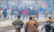  ?? AP ?? Security forces chase protesters away during a protest on the death anniversar­y of separatist Maqbool Bhat in Srinagar on Sunday.