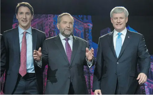  ?? JONATHAN HAYWARD / THE CANADIAN PRESS FILES ?? Justin Trudeau, Tom Mulcair and Stephen Harper pose for a photo before the Calgary leaders’ debate in September 2015.