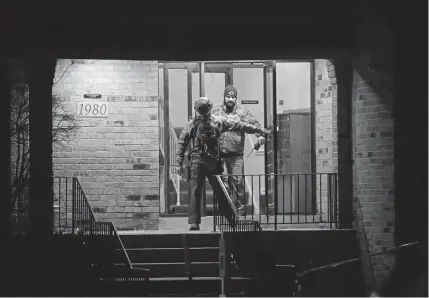  ?? Scott Olson, Getty Images ?? Police search the home of Gary Martin, a 45-year-old man who was killed by officers after he opened fire at the Henry Pratt Co. in Aurora, Ill., on Friday. Aurora is a city of 200,000 people that is about 40 miles west of Chicago.